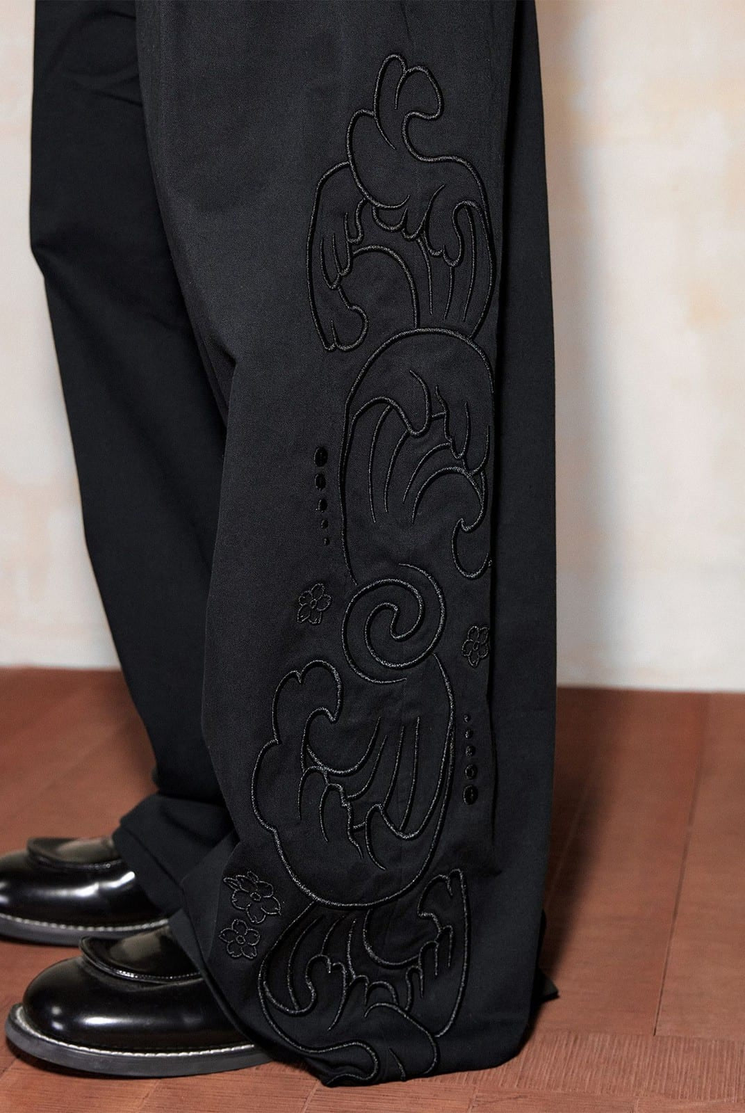MEDM Embroidered Cotton Cargo Pants in Black - On Model
