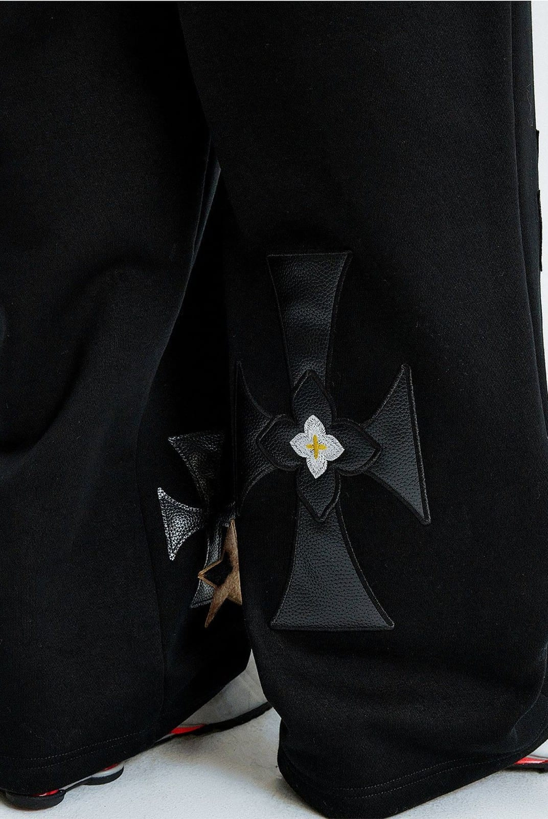 MEDM Leopard Leather Patch Drawstring Pants in Black - On Model