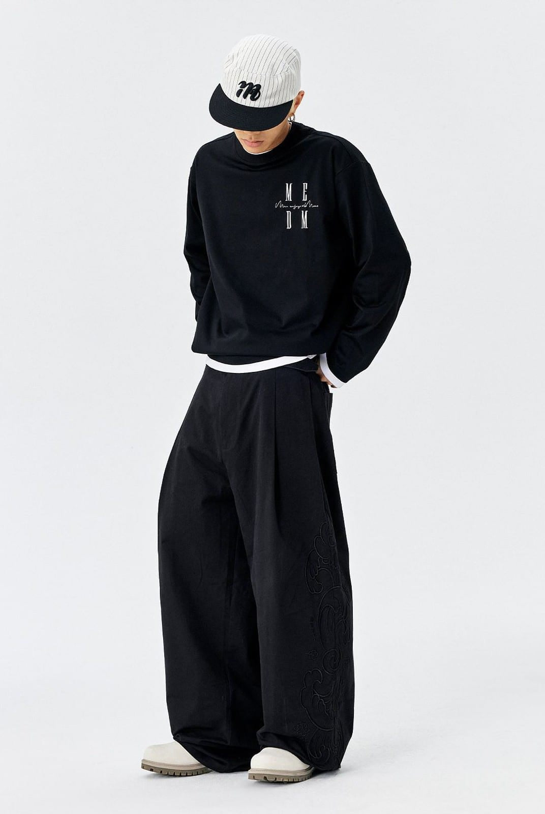 MEDM Embroidered Cotton Cargo Pants in Black - On Male Model