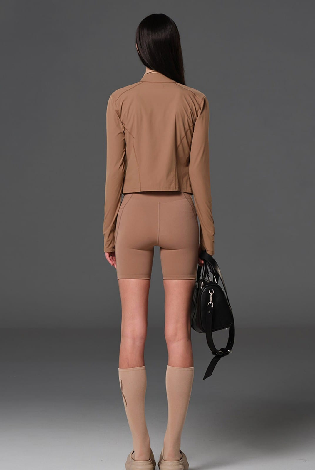 SMFK Cropped Stretch Nylon Track Jacket in Brown - On Female Model