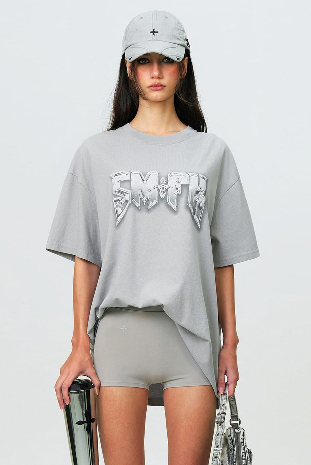 SMFK Metallic Logo Cotton T Shirt in Gray - On Female Model