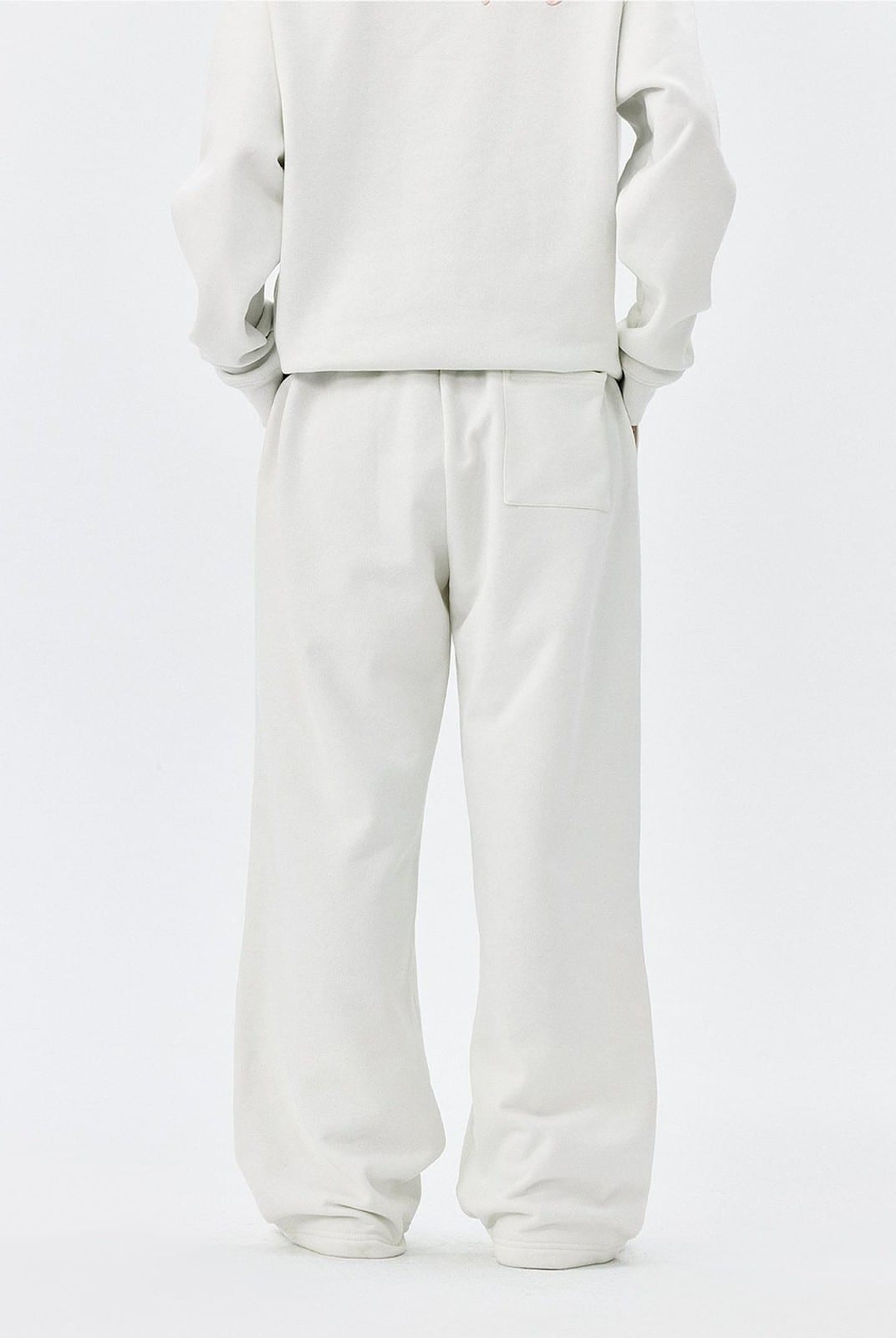 MEDM Fleece Lined Embroidered Sweatpants in White - On Model