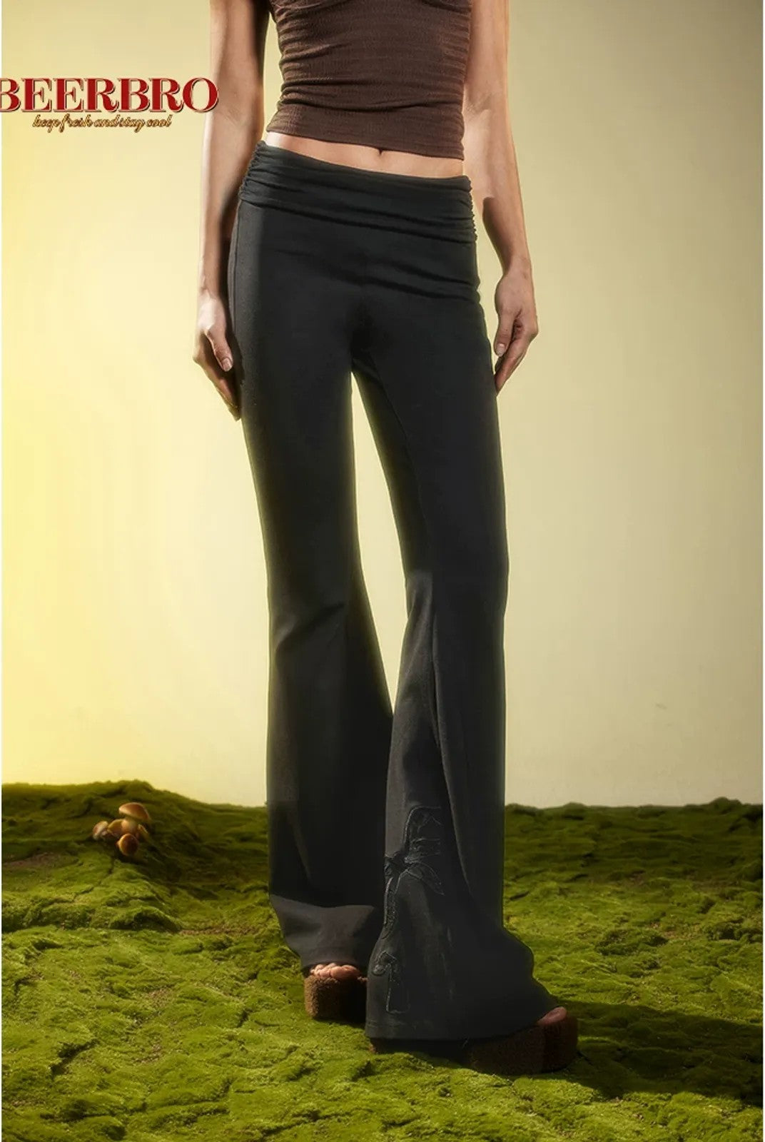 BeerBro Ruched Waist Stretch Flared Pants in Black - On Female Model