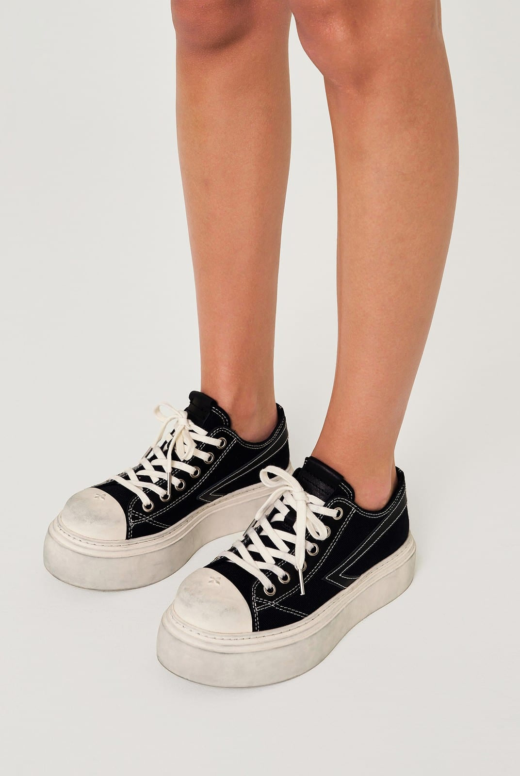SMFK Distressed Canvas Skate Sneakers in Black - On Female Model