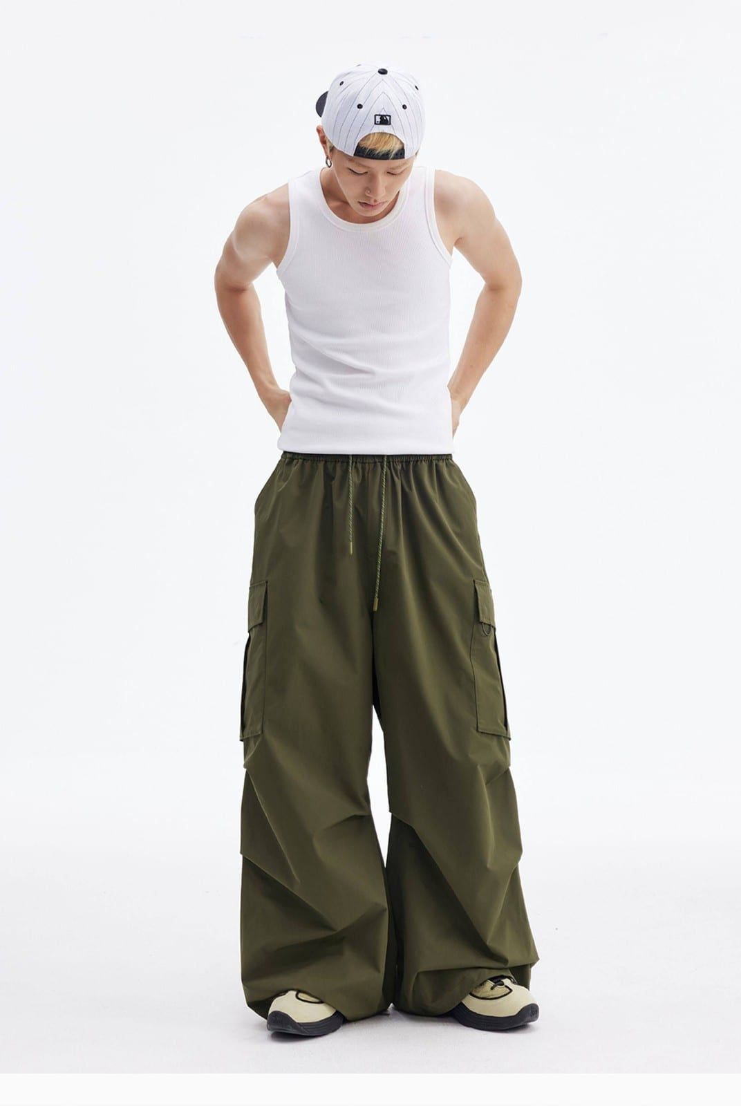 MEDM Multi Pocket Parachute Cargo Pants in Olive - On Male Model