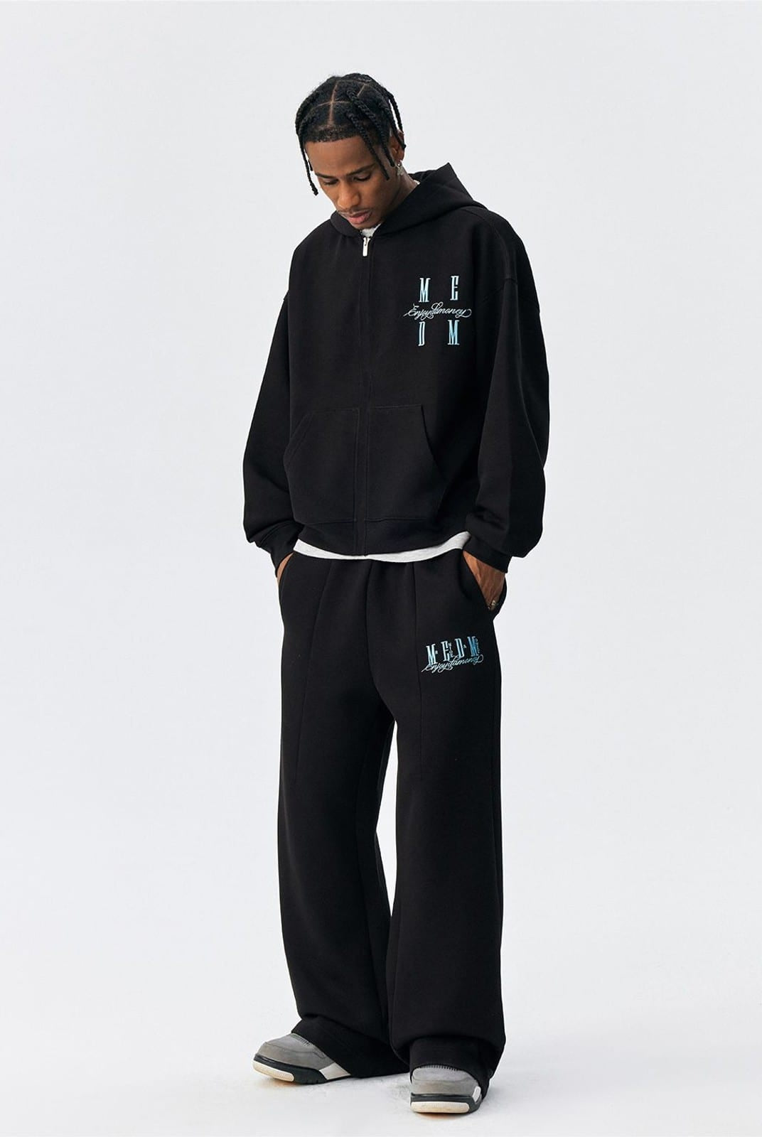 MEDM Embroidered Cotton Blend Zip Up Hoodie in Black - On Male Model
