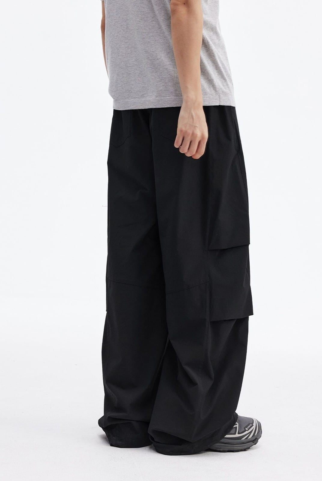 MEDM Crinkled Nylon Parachute Cargo Pants in Black - On Male Model