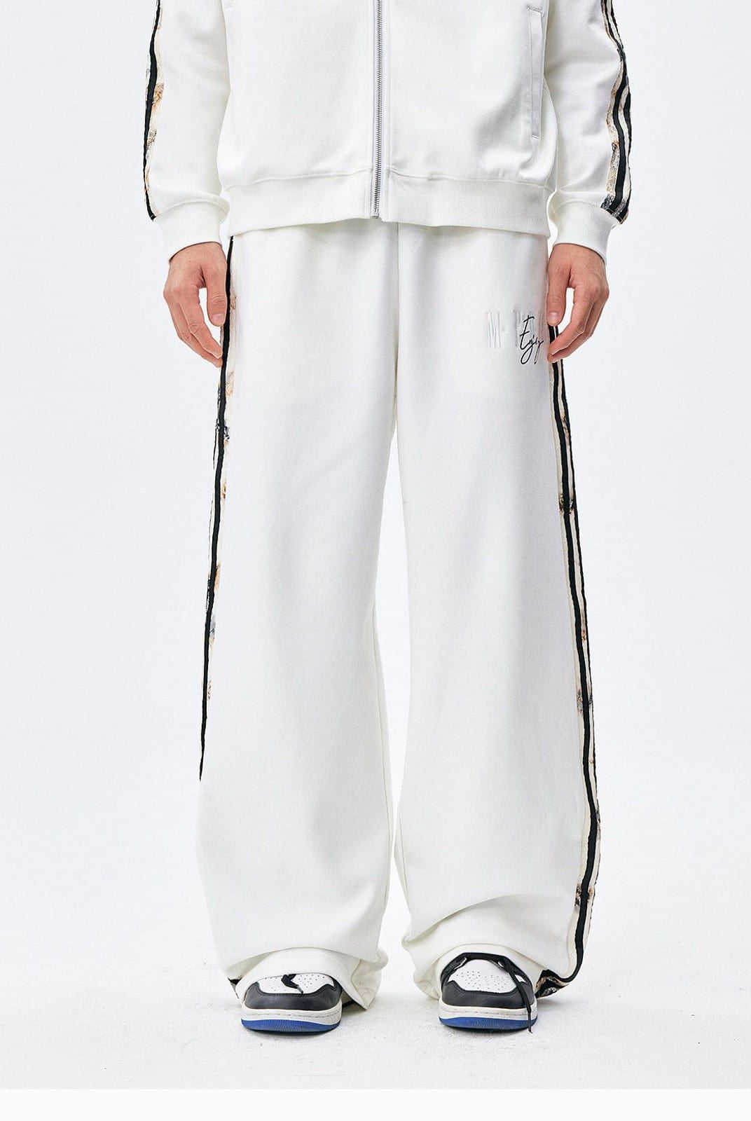 MEDM Lace Paneled Striped Track Pants in White - On Model