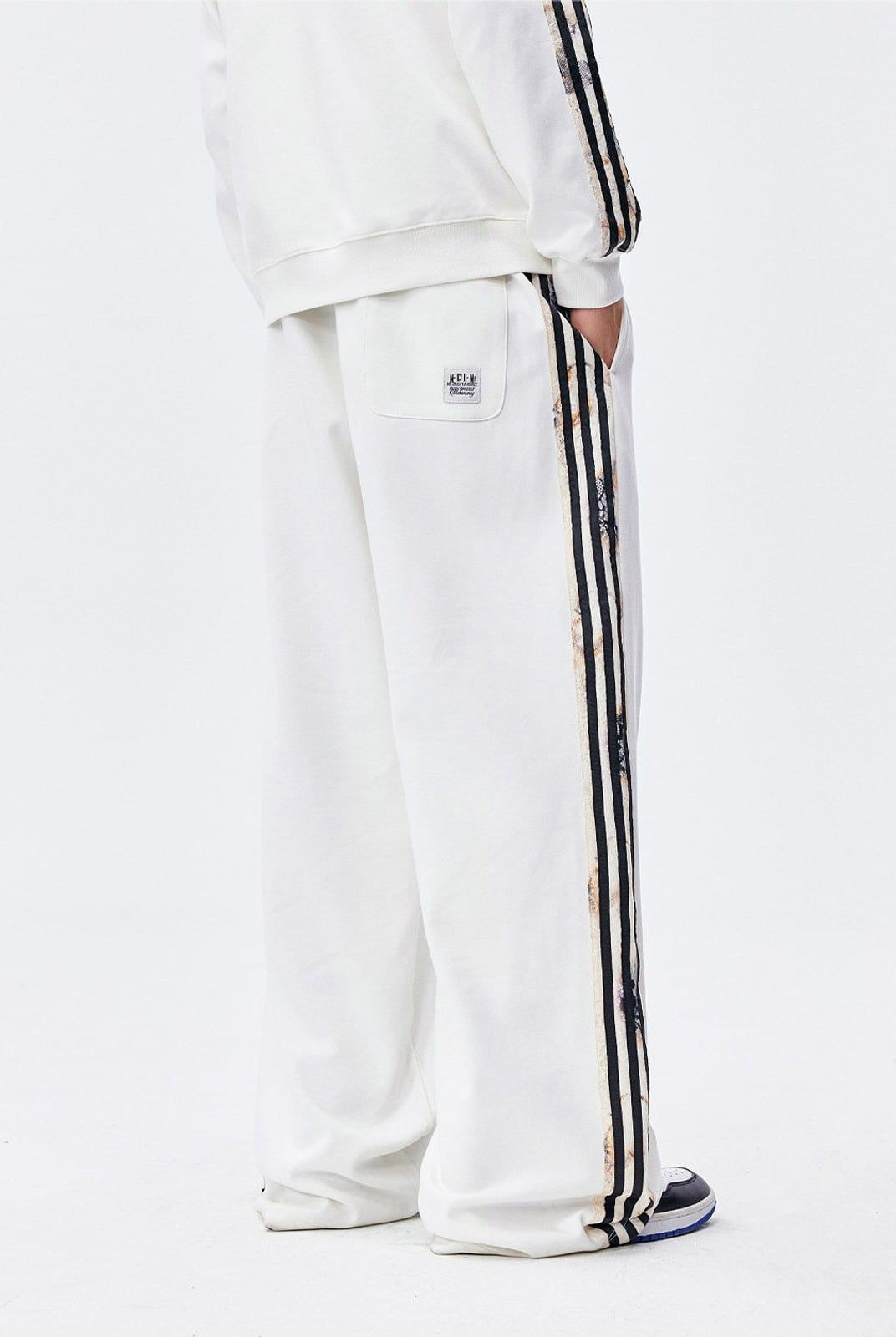 MEDM Lace Paneled Striped Track Pants in White - On Model