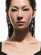 BLACKHEAD Manta Ray Mother of Pearl Drop Earrings in Silver - On Female Model