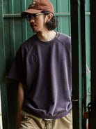 USAGE Vintage Wash Distressed Short Sleeve Sweatshirt in Purple - On Male Model