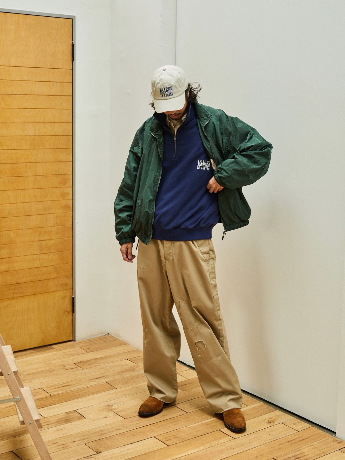 USAGE Lightweight Nylon Zip Up Jacket in Green - On Male Model