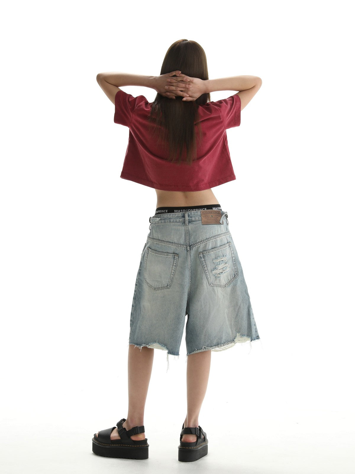 MASONPRINCE Light Wash Raw Hem Denim Shorts in Blue - On Female Model