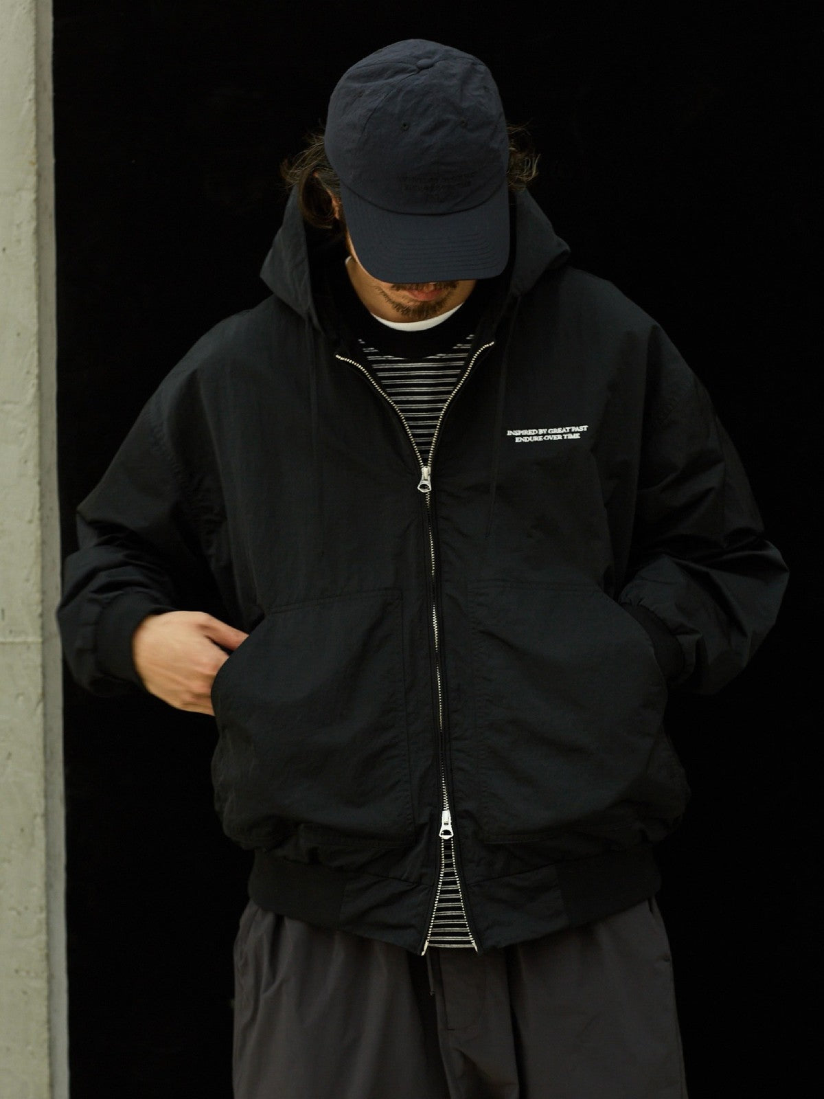 USAGE Crinkle Nylon Hooded Track Jacket in Black - On Male Model