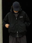 USAGE Crinkle Nylon Hooded Track Jacket in Black - On Male Model