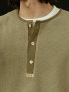 USAGE Heavyweight Waffle Knit Henley Sweatshirt in Olive - On Male Model