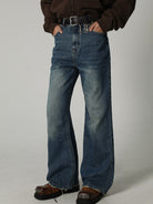 MASONPRINCE High Waisted Distressed Flared Jeans in Navy Blue - On Male Model
