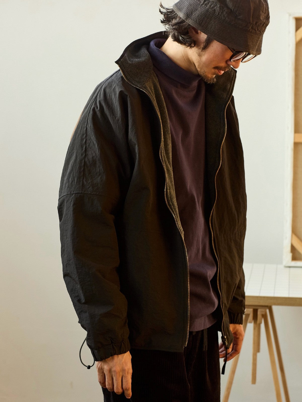 USAGE Reversible Nylon Fleece Track Jacket in Black - On Male Model