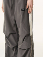BLINDNOPLAN Contrast Panel Pleated Parachute Pants in Gray - On Model