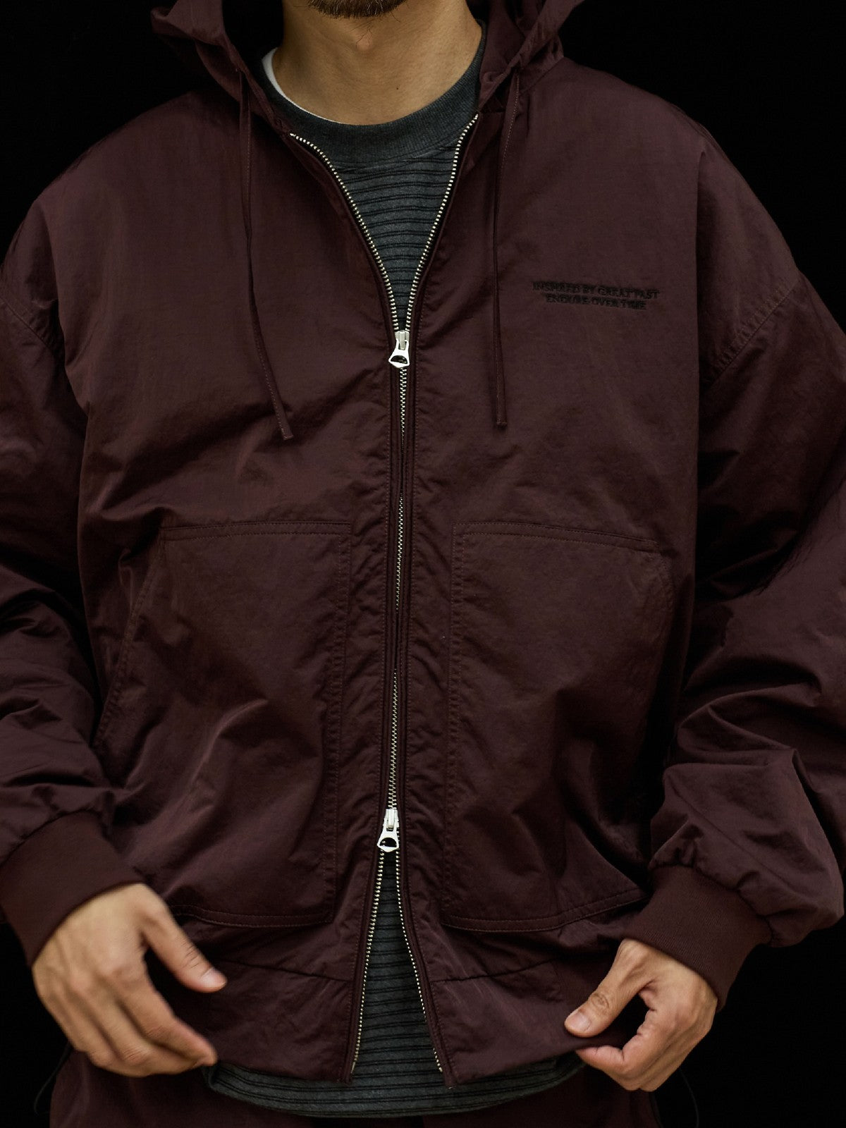 USAGE Crinkle Nylon Hooded Track Jacket in Brown - On Male Model