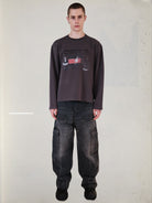 UNKNOWNWORLD Throbbing Gristle Waffle Sweatshirt in Dark Gray - On Male Model