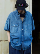 USAGE Distressed Short Sleeve Denim Shirt in Denim - On Male Model