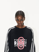 BLINDNOPLAN Color Block Graphic Raglan Sweatshirt in Black - On Female Model