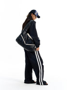 BLINDNOPLAN Striped Pleated Track Pants in Black - On Female Model