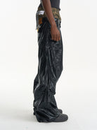 BLINDNOPLAN Faux Leather Layered Cargo Pants in Black - On Male Model