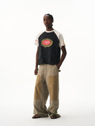 BLINDNOPLAN Color Block Raglan Graphic T Shirt in Black - On Male Model
