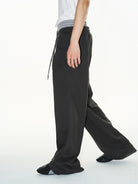 BLINDNOPLAN Double Waistband Pleated Sweatpants in Dark Gray - On Male Model