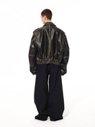 UNKNOWNWORLD Distressed Padded Eco Leather Jacket in Black - On Model