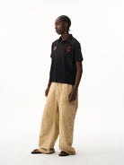 BLINDNOPLAN Distressed Embroidered Cotton Polo in Black - On Male Model