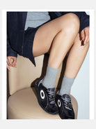 OLDORDER Hello Kitty Velvet GAT Sneakers in Black - On Female Model