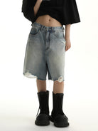 MASONPRINCE Light Wash Raw Hem Denim Shorts in Blue - On Female Model