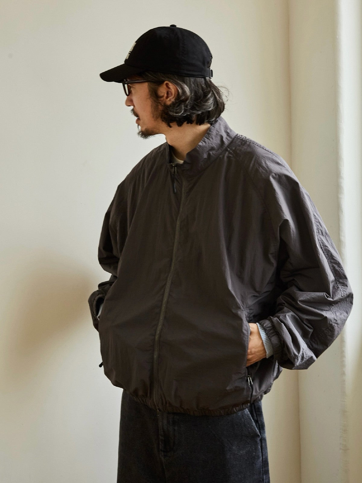 USAGE Lightweight Nylon Zip Up Jacket in Gray - On Male Model