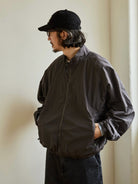 USAGE Lightweight Nylon Zip Up Jacket in Gray - On Male Model