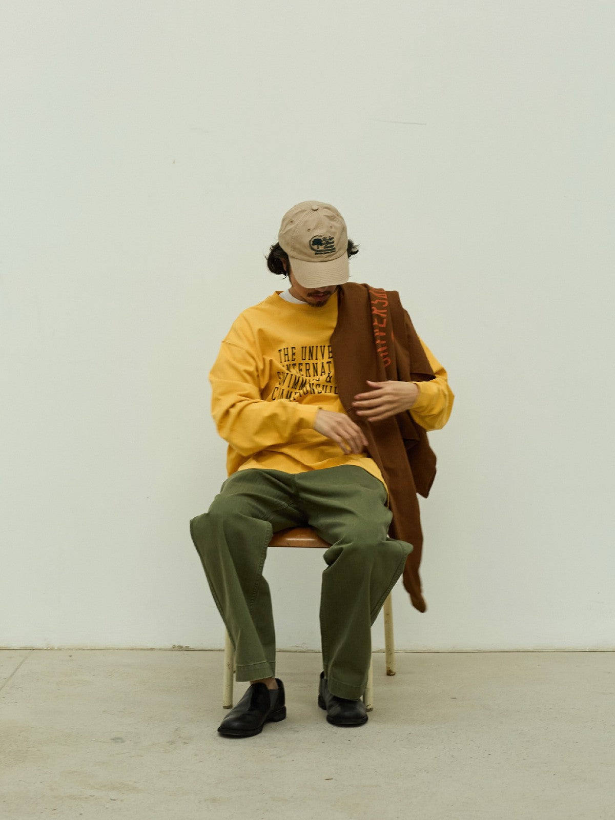 USAGE Heavyweight Herringbone Twill Belted Trousers in Olive - On Male Model