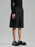BLINDNOPLAN Textured Rivet Suit Shorts in Black - On Male Model