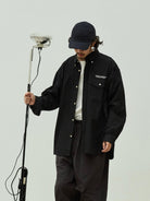USAGE Oversized Micro Check Button Down Shirt in Black - On Male Model