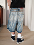 UNKNOWNWORLD Distressed Wash Baggy Shorts in Blue - On Model