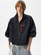 MASONPRINCE Lightweight Tonal Check Nylon Jacket in Navy Blue - On Female Model