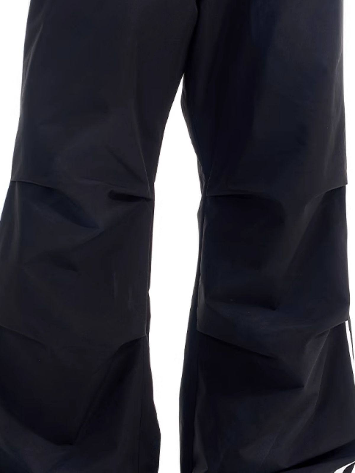 BLINDNOPLAN Striped Pleated Track Pants in Black - On Female Model