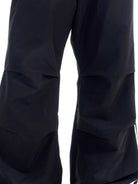BLINDNOPLAN Striped Pleated Track Pants in Black - On Female Model