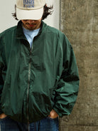 USAGE Lightweight Nylon Zip Up Jacket in Green - On Male Model