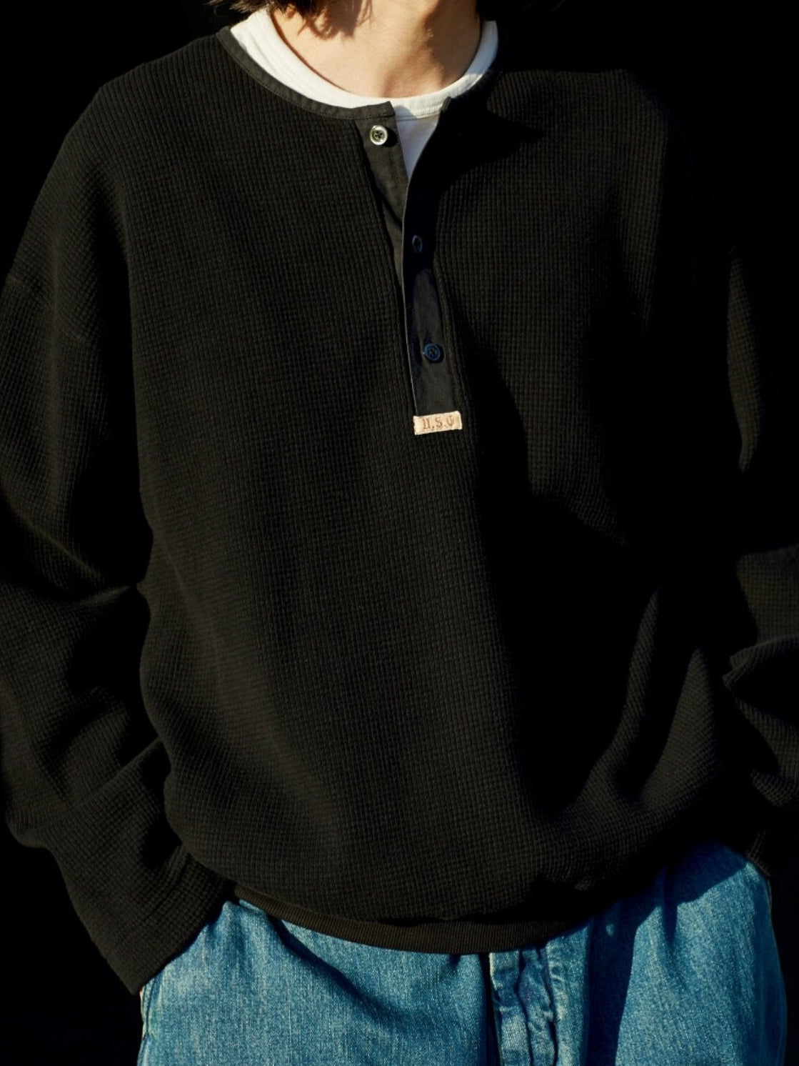 USAGE Heavyweight Waffle Knit Henley Sweatshirt in Black - On Male Model