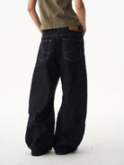 BLINDNOPLAN Curved Wide Leg Raw Denim Jeans in Denim - On Model