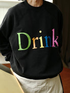USAGE Washed Cotton Graphic Sweatshirt in Black - On Male Model
