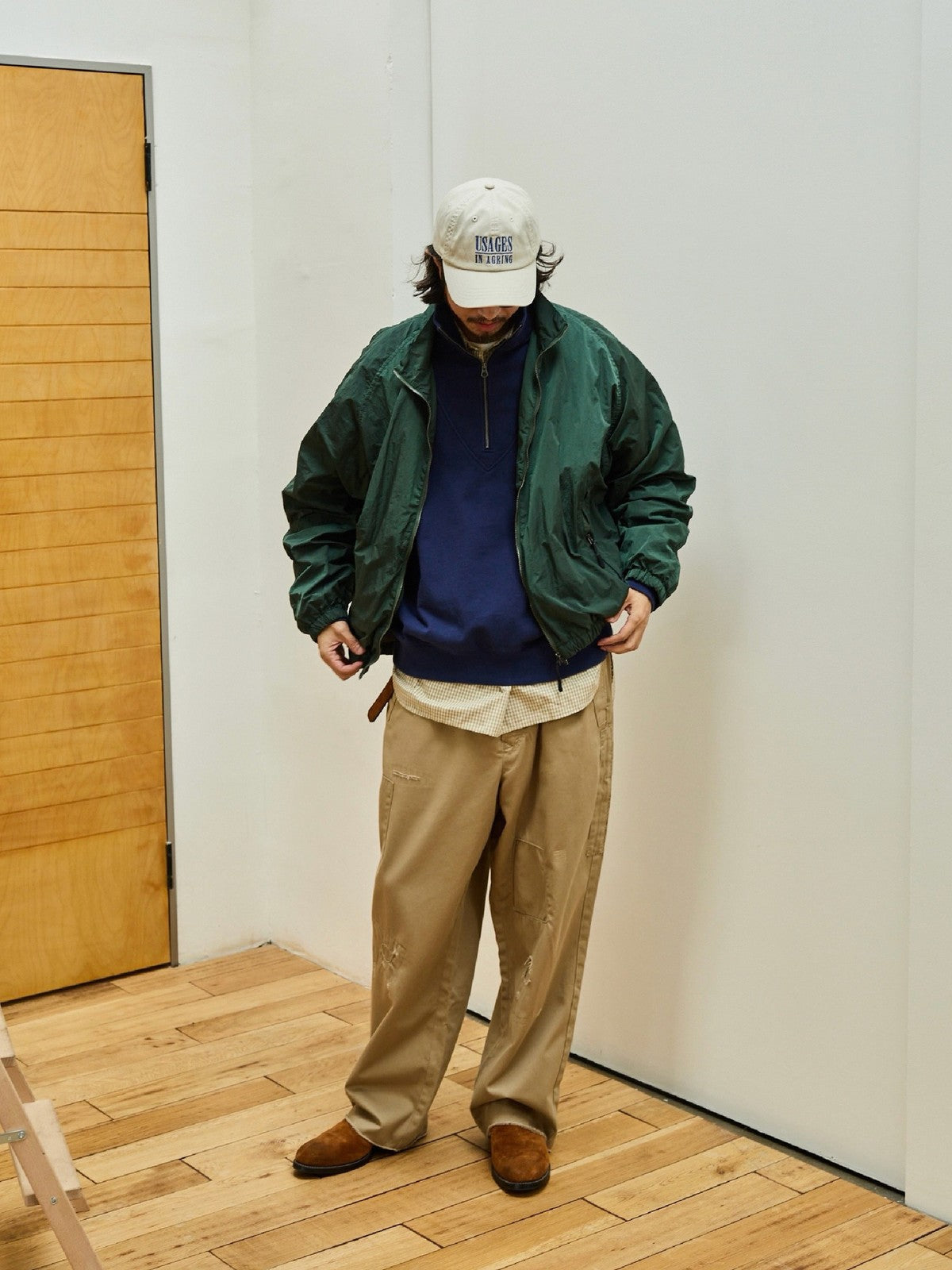 USAGE Lightweight Nylon Zip Up Jacket in Green - On Male Model