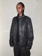 UNKNOWNWORLD Waxed Deconstructed M65 Jacket in Black - On Female Model